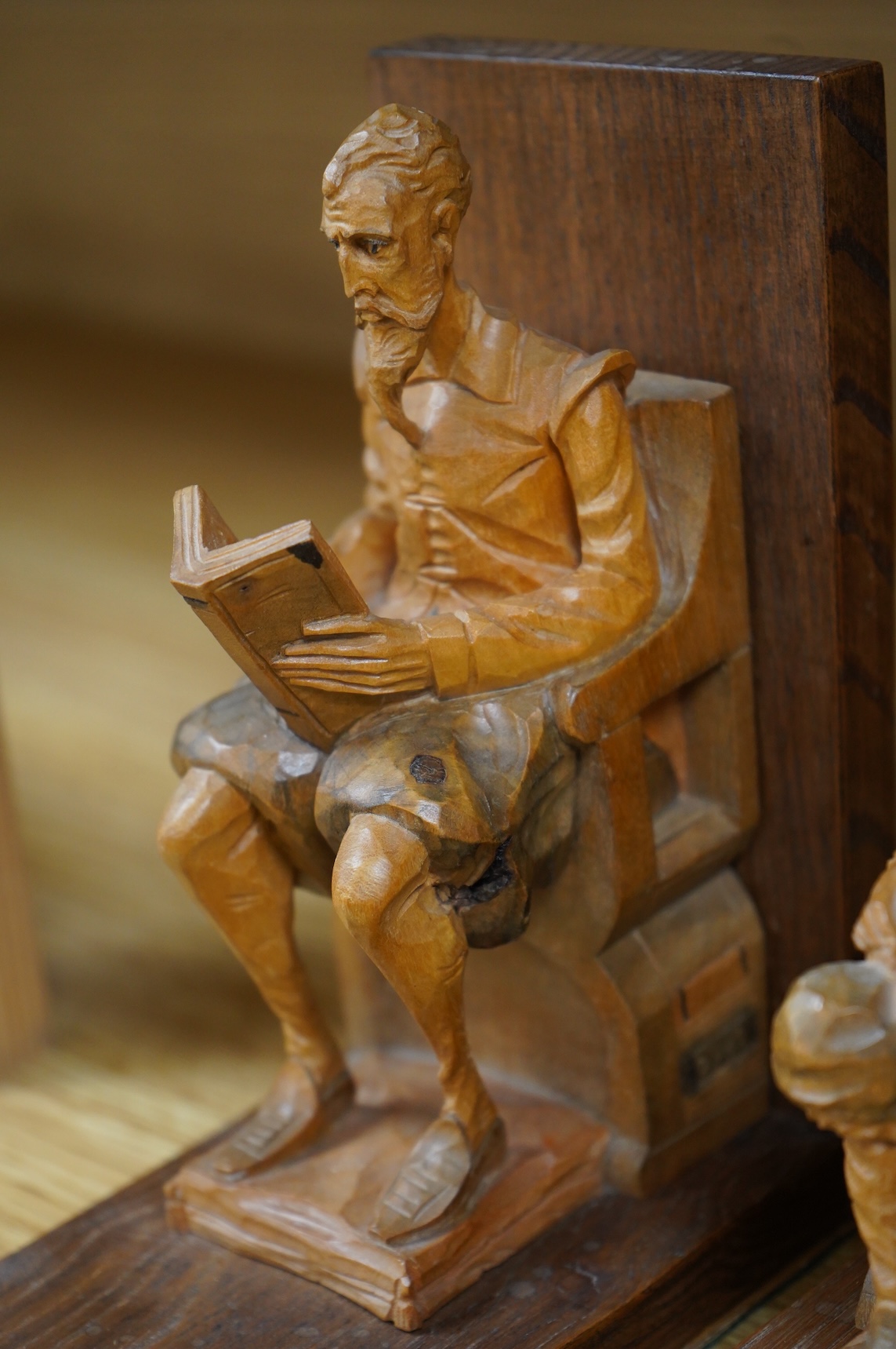 A pair of Bavarian carved wood figural bookends, 17cm high